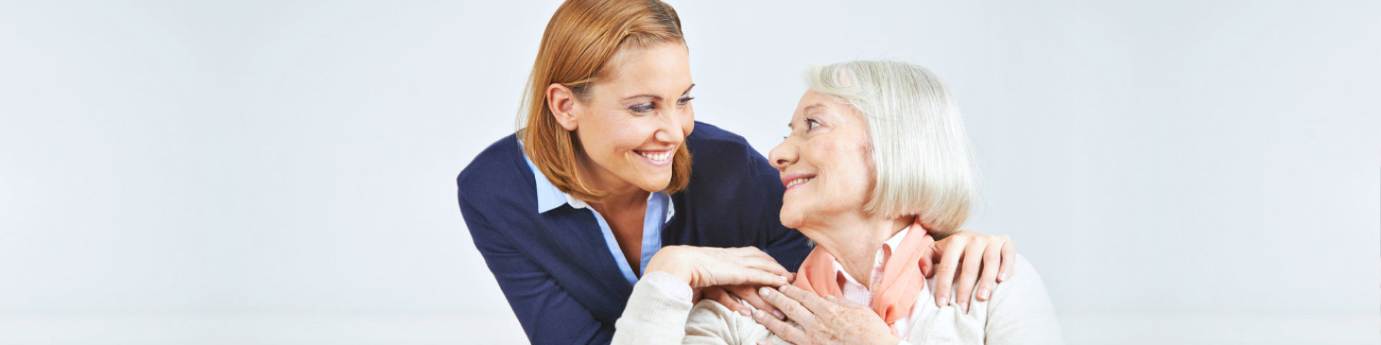 caregiver and senior woman having a conversation